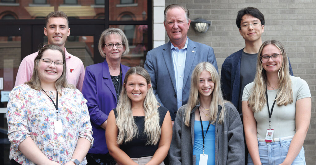 Group photo of summer interns with Charles Makey and Kelly Julius